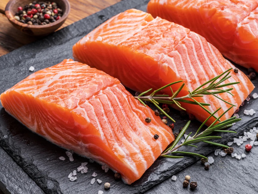 Picture of a scientist looking through a microscope.